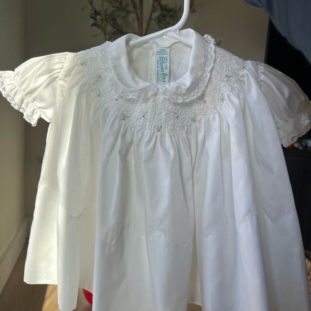 Classic White Smocked Baby Dress with Pink Accents and Bonnet